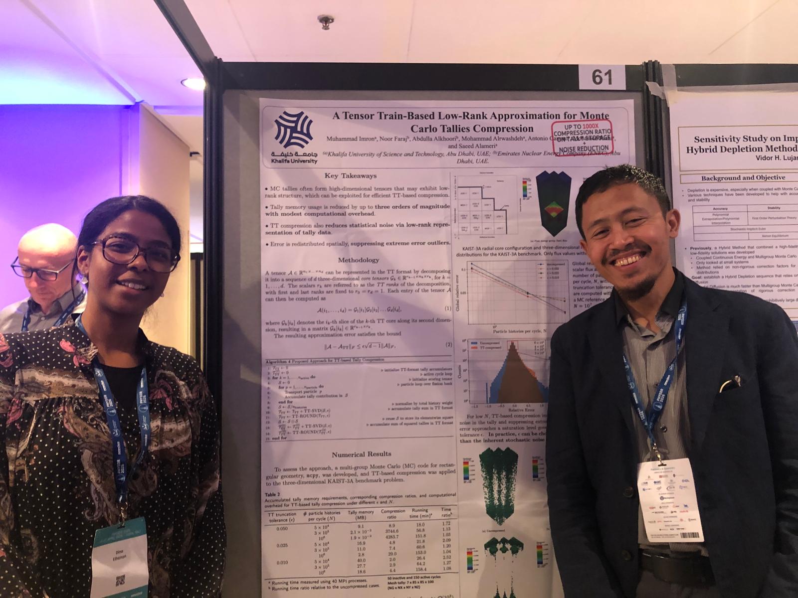 A picture of me (Dina Elhanan, left) and Dr. Muhammed Imron (right) standing in front of his research poster presenting his group's research article A Tensor Train-Based Low-Rank Approximation for Monte Carlo Tallies Compression. This was during the poster session on April 22, 2026 as part of PHYSOR'26.